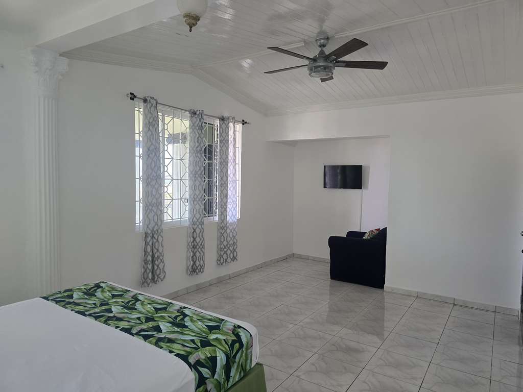 Master bedroom suite with premium linens and tropical views