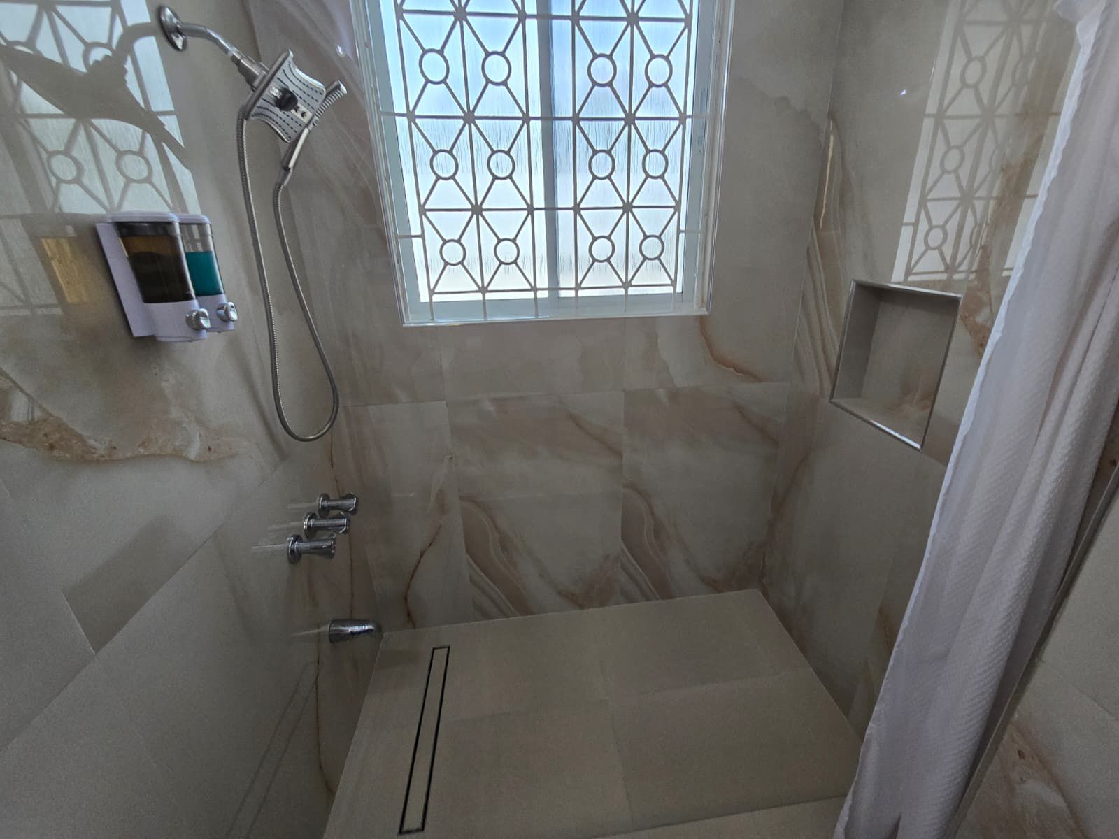 Sleek vanity area with contemporary lighting and high-end fixtures