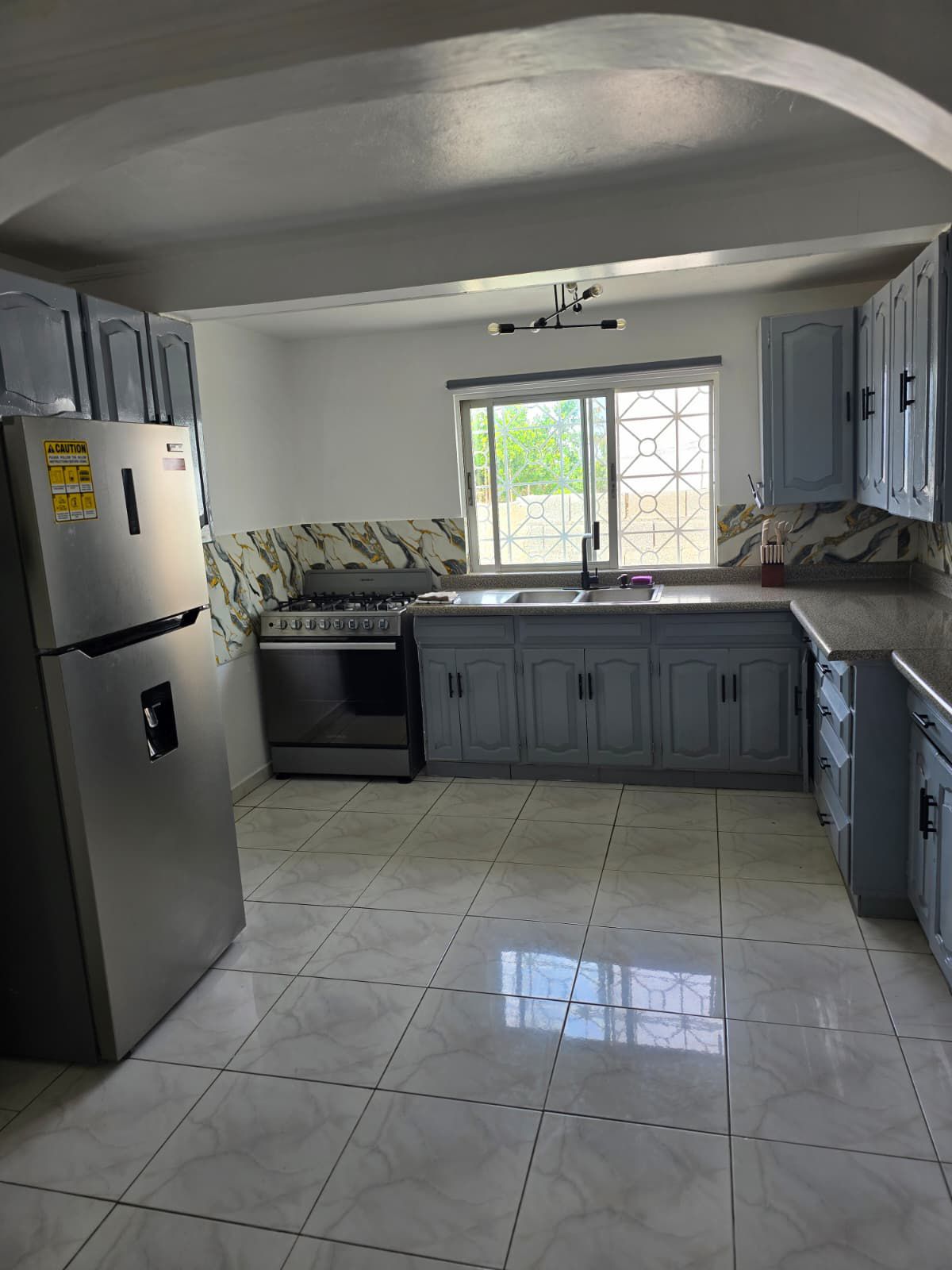 Chef-ready kitchen with modern appliances and island seating